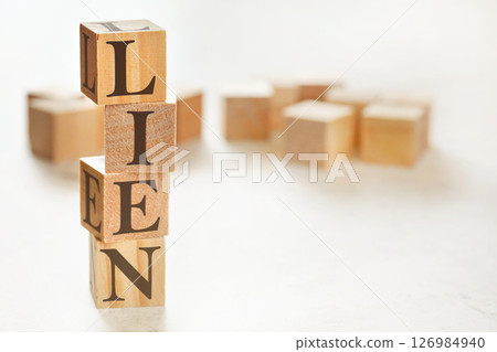 Four wooden cubes arranged in stack with word LIEN on them, space for text / image at down right corner Four wooden cubes arranged in stack with word LIEN on them, space for text / image at down right corner 126984940
