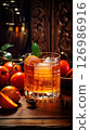 Festive Spiced Persimmon Bourbon Cocktail for Holiday Cheer 126986916