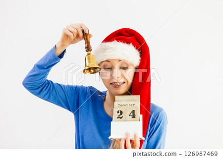 Woman and christmas calendar with bell 126987469