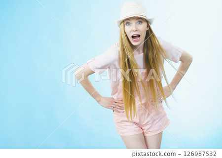 Shocked woman wearing summer outfit 126987532