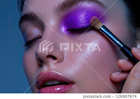 Vivid Purple Eyeshadow Application Close-Up 126987674