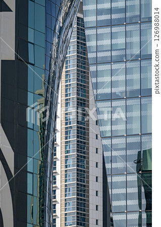 Different glass walls of buildings. Architecture details. Abstract background Different glass walls of buildings. Architecture details. Abstract background 126988014