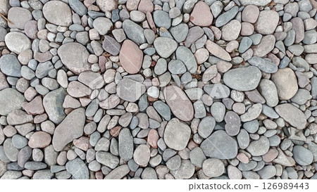 River pebbles with different textures close-up. Stone background 126989443