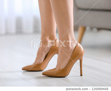 Feet wearing pumps 126989488