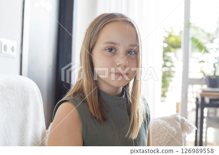 Beautiful child girl sitting at home, indoor portrait 126989558