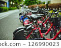 Rental bicycles lined up in a bicycle parking lot 126990023