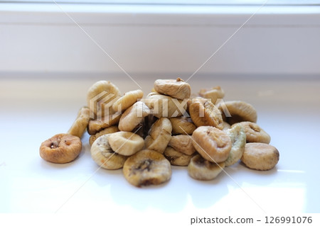 Many tasty dried figs as background, top view Many tasty dried figs as background, top view 126991076