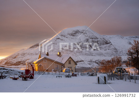 House and a mountain in the sunset, Norway 126991732