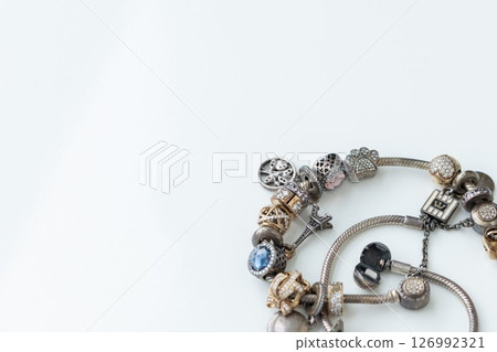 Oxidated jewellery on a white background. Closeup, selective focus. 126992321