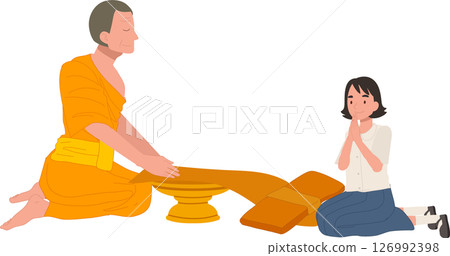 A Thai student girl offers a bathing robe to a monk during Buddhist Lent 126992398