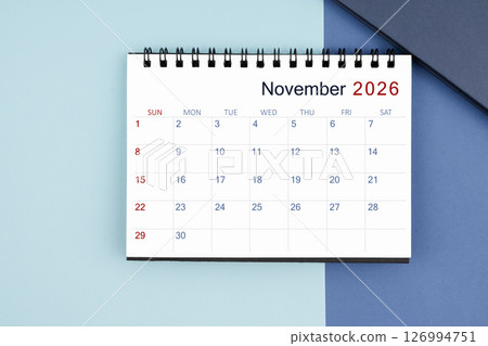 November 2026 monthly desk calendar for 2025 year on blue background. 126994751