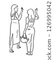 Full-body illustration of two young women waving goodbye 126995042