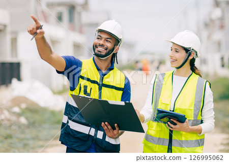 Construction Engineer team, Engineers teamwork man and women working together at construction site Construction Engineer team, Engineers teamwork man and women working together at construction site 126995062