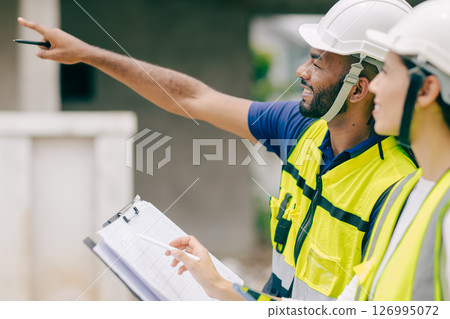 Happy Construction Engineer man smiling, foreman worker satisfied with project success happiness smile Happy Construction Engineer man smiling, foreman worker satisfied with project success happiness smile 126995072