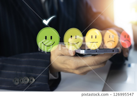 Users rate their service experience on the online application for a customer satisfaction survey concept. 126995547