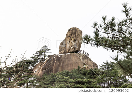 Flying Rock formation peak at Huangshan or Yellow Mountain, popular tourism landmark in China Flying Rock formation peak at Huangshan or Yellow Mountain, popular tourism landmark in China 126995602