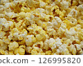 Close up of Buttered Popcorn Crispy and Delicious Snack. Snack food for movies background image. 126995820