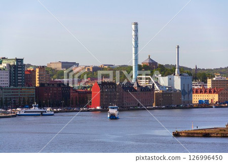 City skyline with ferry crossing Gota river in centre from Kvillepiren on sunny day in Gothenburg, Sweden 126996450