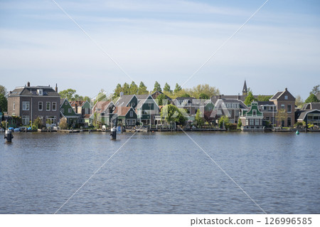 Sunny day at Zaanse Schans (wooden houses and green space) / Netherlands 126996585