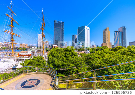 Tokyo cityscape in Japan, overlooking the buildings in front of Sakuragicho Station and the sailing ship Nippon Maru Tokyo cityscape in Japan, overlooking the buildings in front of Sakuragicho Station and the sailing ship Nippon Maru 126996726