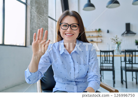 Webcam view of middle aged woman having video conference, chat Webcam view of middle aged woman having video conference, chat 126996750