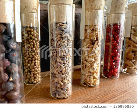 Set of glass jars with defferent spices. 126996830