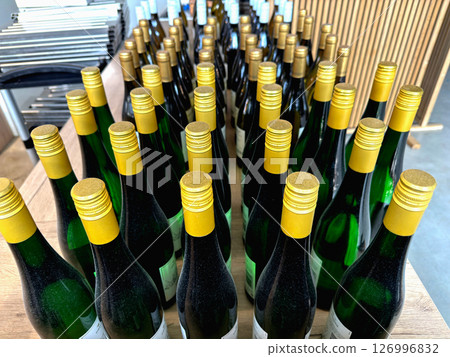 Bottles of white wine lined up Bottles of white wine lined up 126996832
