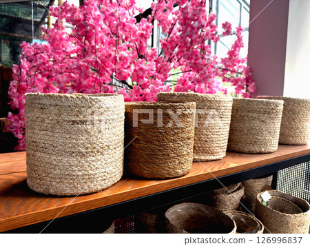 Various woven basket on shelves indoors 126996837