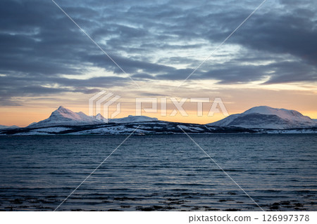 Sea and mountains with snow in the sunset, Norway 126997378