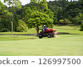 Golf course green and greenkeeper 126997500