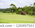 Golf course green and greenkeeper 126997501