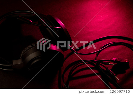 Black headphones on a dark background Black headphones on a dark background 126997710