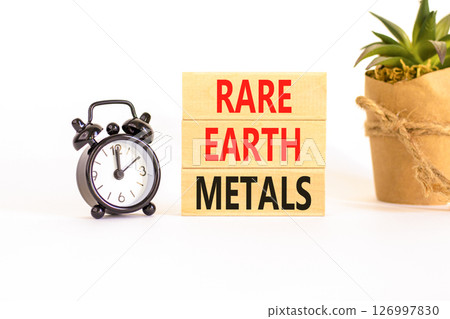 Rare earth metals symbol. Concept words Rare earth metals on beautiful wooden block. Black alarm clock. Beautiful white background. Business and rare earth metals concept. Copy space. Rare earth metals symbol. Concept words Rare earth metals on beautiful wooden block. Black alarm clock. Beautiful white background. Business and rare earth metals concept. Copy space. 126997830