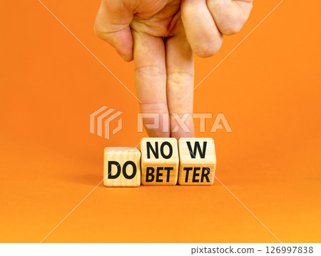Do better and now symbol. Concept words Do better Do now on wooden block. Beautiful orange table orange background. Businessman hand. Business do better and now concept. Copy space. Do better and now symbol. Concept words Do better Do now on wooden block. Beautiful orange table orange background. Businessman hand. Business do better and now concept. Copy space. 126997838