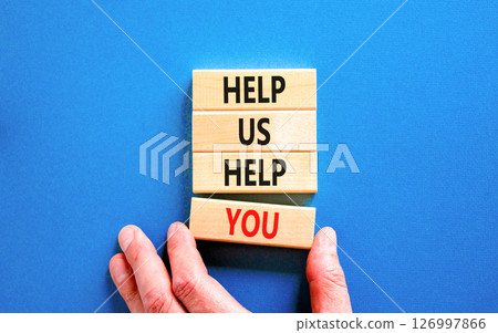 Help you symbol. Concept words phrase Help us help you on beautiful wooden blocks. Beautiful blue paper background. Businessman's hand. Business Help you concept. Copy space. 126997866