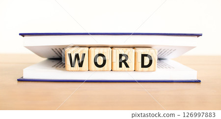 Word symbol. Concept word Word on beautiful wooden blocks in book. Beautiful wooden table white background. Business, lifestyle, support and word concept. Copy space. 126997883