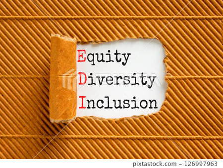 EDI equity diversity inclusion symbol. Concept words EDI equity diversity inclusion on white paper on beautiful brown background. Business EDI equity diversity inclusion concept. Copy space. EDI equity diversity inclusion symbol. Concept words EDI equity diversity inclusion on white paper on beautiful brown background. Business EDI equity diversity inclusion concept. Copy space. 126997963