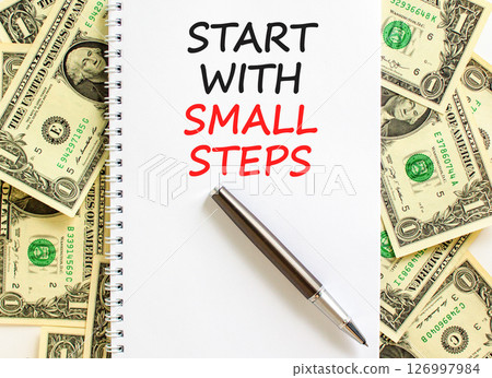 Start with small steps symbol. Concept words phrase Start with small steps on beautiful white note. Dollar bills. Beautiful dollar bills background. Business Start with small steps concept. Copy space Start with small steps symbol. Concept words phrase Start with small steps on beautiful white note. Dollar bills. Beautiful dollar bills background. Business Start with small steps concept. Copy space 126997984