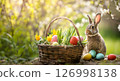 Easter bunny and basket of colorful eggs and tulip flowers in spring garden 126998138