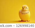 Tiny yellow chick peering out from cracked egg on yellow backdrop. Easter concept 126998140