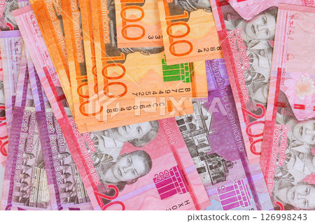 Dominican Republic bills peso banknotes in multiple denominations arranged neatly for viewing. Dominican Republic bills peso banknotes in multiple denominations arranged neatly for viewing. 126998243
