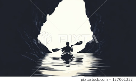 Serene kayak journey through a majestic cave with reflection on calm waters during a tranquil day 127001332