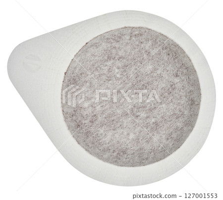 White, round coffee pod or Easy Serving Espresso pod, filled with ground coffee, isolated background White, round coffee pod or Easy Serving Espresso pod, filled with ground coffee, isolated background 127001553