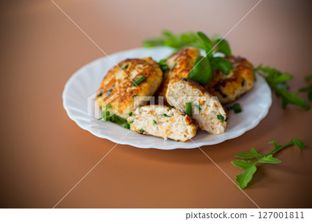 Juicy chicken cutlets in oil served for dinner Juicy chicken cutlets in oil served for dinner 127001811
