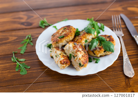 Crispy chicken cutlets for dinner close-up on a wooden table Crispy chicken cutlets for dinner close-up on a wooden table 127001817