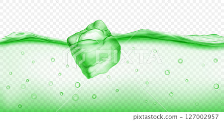 Ice cube floating in water, in green colors. 127002957