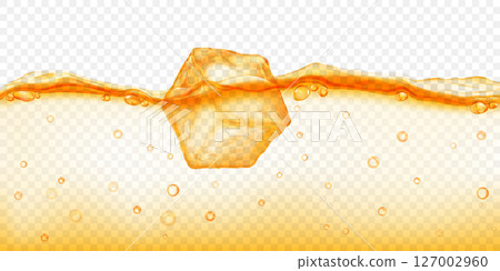 Ice cube floating in water, in yellow colors. 127002960