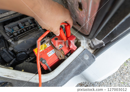 A light truck with an engine compartment under the passenger seat - Charging the battery 127003012