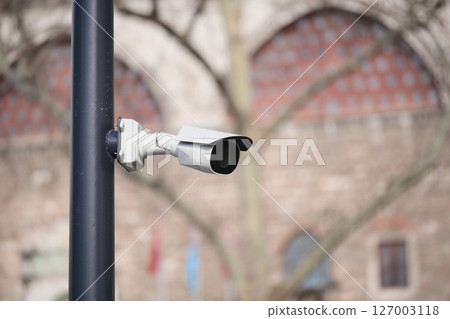 Security camera installed in urban area with historical background Security camera installed in urban area with historical background 127003118