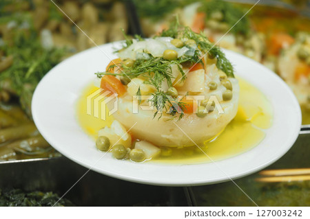 Delicious vegetable dish served in a traditional setting 127003242